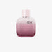 Bottle of L.12.12 Rose Eau Intense perfume with floral elements like rose, iris, cotton flower, and cedarwood in the background