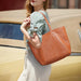 Soft genuine leather casual tote bag for women with multiple interior pockets and zipper closure