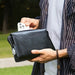 Men’s genuine leather clutch bag with zipper closure and phone pocket