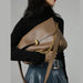 Women’s soft cow leather shoulder bag with chain accent and flap design
