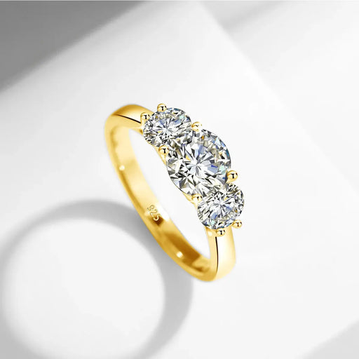 3-stone D color moissanite engagement ring in S925 silver with 18K yellow gold plating and diamond accents