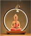 Ceramic Sakyamuni Buddha backflow incense burner with LED lamp and waterfall smoke effect for meditation and home décor.