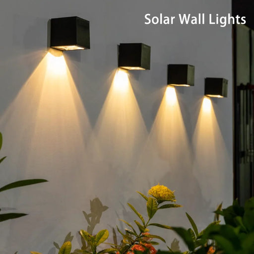Dimmable solar wall washing LED light mounted on an outdoor wall