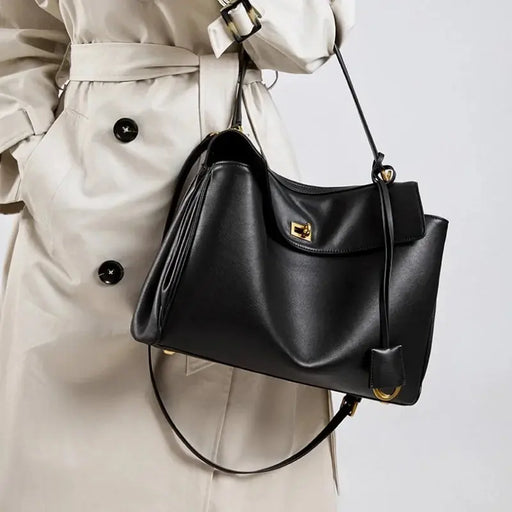Women’s casual leather satchel handbag with secure hasp closure and organized interior