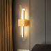 Black and gold contemporary LED wall lamp with dual up-and-down lighting for modern interiors.

