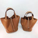 Soft cowhide leather unisex bucket bag with open top, lock, scarves