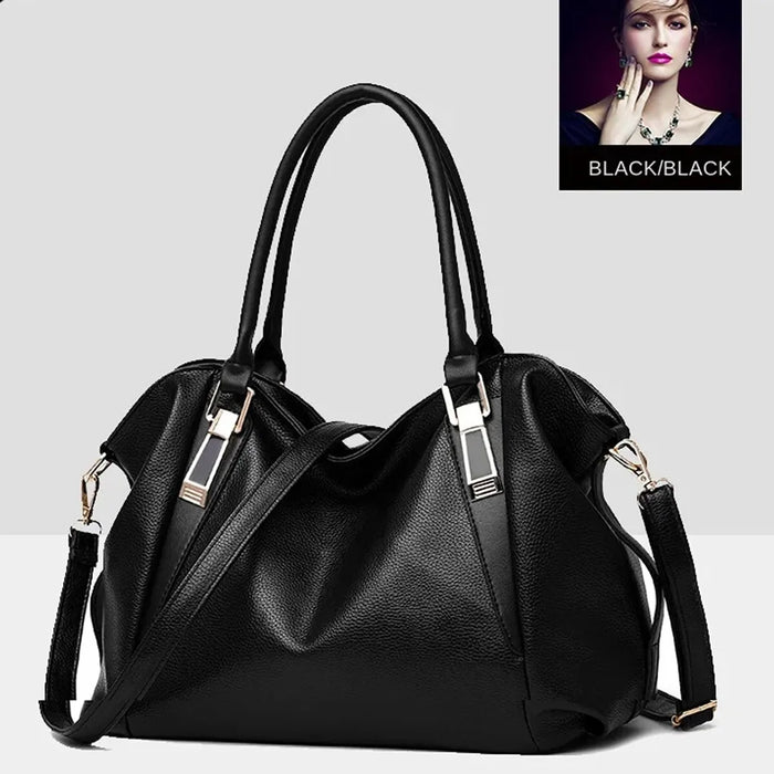 Large black pebbled leather women's tote handbag with dual top handles, gold-tone metal hardware, and removable adjustable shoulder strap