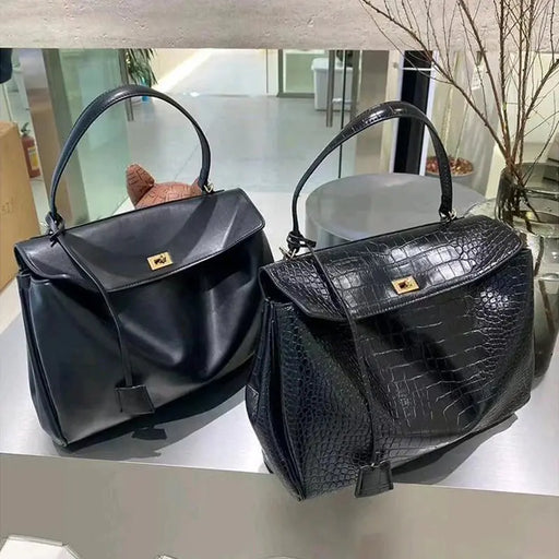 Women’s casual denim shoulder bag with structured tote shape and hasp closure