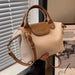 Trendy bucket messenger bag with barrel shape, flap closure, and crossbody strap for men and women