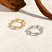 Sterling silver round moissanite wedding band with D-colour stone.