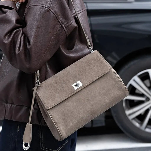 Women’s minimalist leather shoulder bag with hasp closure and casual tote design