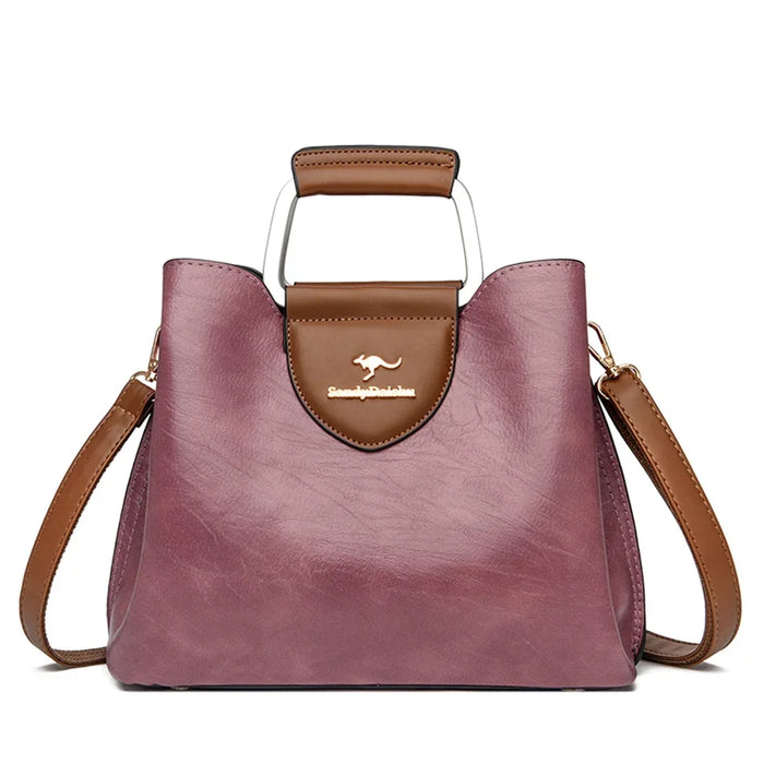 Casual tote handbag made from microfiber synthetic leather with zipper closure and multiple storage compartments.