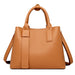 Luxury designer tote handbag in PU leather with structured design, zipper & hasp closure, and multiple interior pockets.