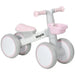 Lightweight pink toddler balance bike with adjustable seat and enclosed wheels