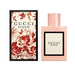 Gucci Bloom Eau de Parfum 50ml bottle, showcasing its pale pink lacquer and floral label.   
