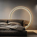 Black Nordic style LED wall sconce mounted on a modern interior wall