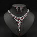 Gold-plated red ruby necklace set with cubic zirconia stones for women, elegant jewelry on white background