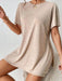 Woman wearing a two-piece lounge set with round neck top and side-slit shorts