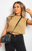 Model wearing Knitted Sleeveless Crop Top in ribbed knit fabric, paired with high-waisted jeans