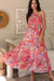 Woman wearing a smocked tiered maxi dress in flowy polyester fabric – UK sizes 8 to 18